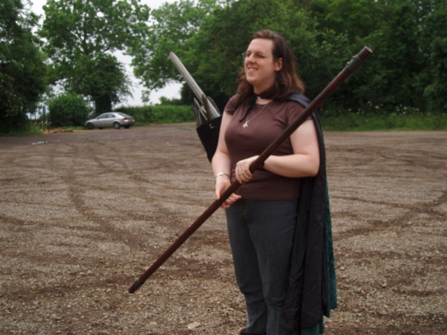 Here Christi demonstrates the smug grin of somebody carrying more weapons than you can shake a fairly large stick at.