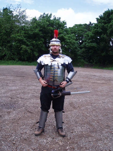 Richard has new and shiny Lorica Segmentata. You know what's really funny? Watching him try to put his greaves on after he's laced himself in.
